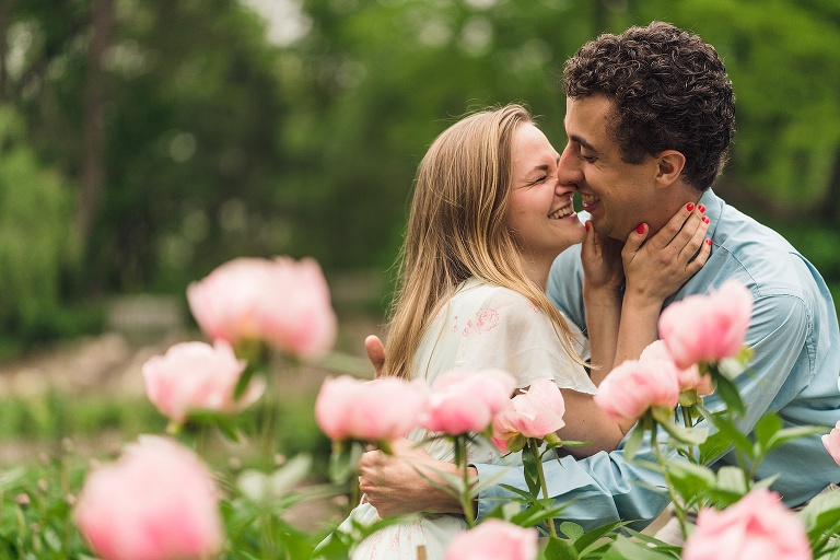 couple with peonies at the Nichols arboretum din Ann Arbor, MI