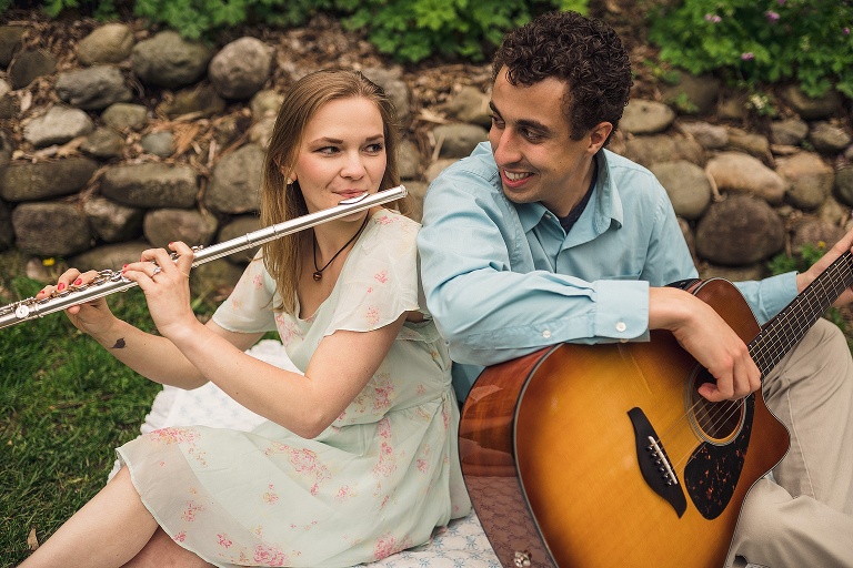 couple playing instruments together at the Nichols arboretum