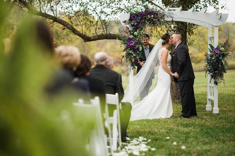 First kiss photo from Saginaw, Michigan wedding photographers